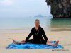 Photo of Elle Bieling doing Dragonfly Pose in Yin Yoga, on Pranang Beach, Railay, Thailand